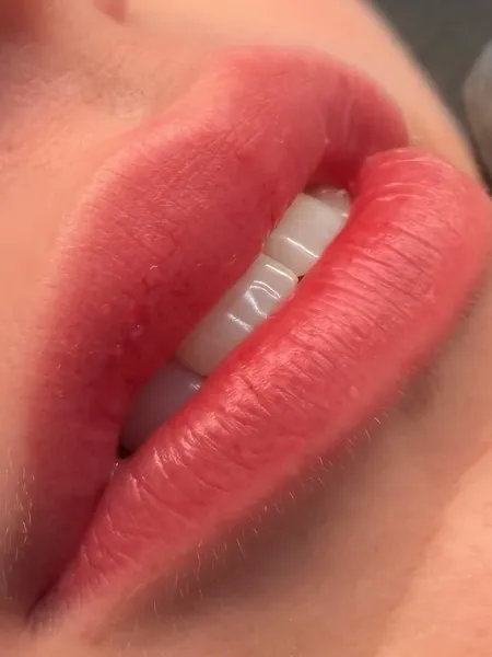 Lip blush result with a soft rosy tint